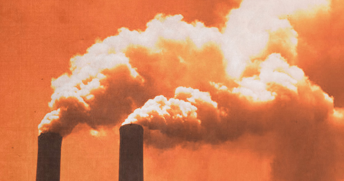 Smoke rolling out of industrial smoke stacks