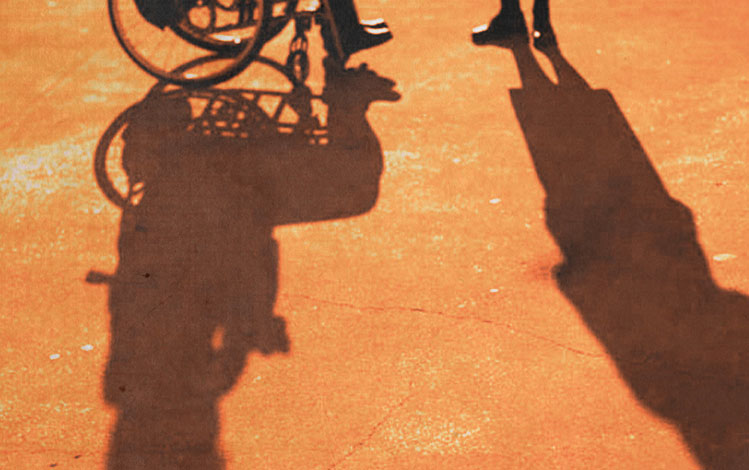 Shadow of a man in a wheel chair