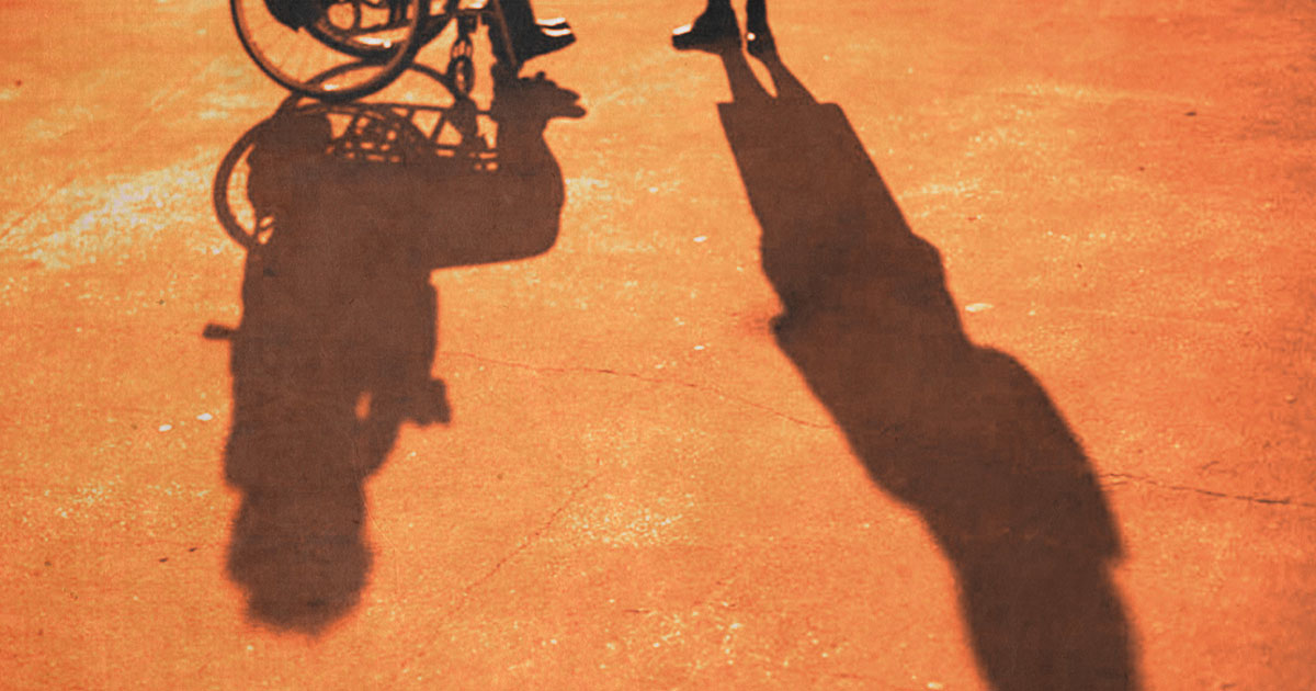 Shadow of a man in a wheel chair